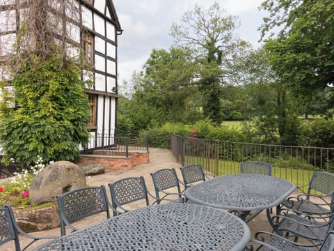 Outdoor furniture on patio | Brook House - Netherley Hall Cottages, Mathon, near Malvern