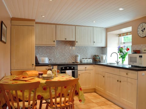 Well-equipped kitchen and dining area | Gullieside Cottage, Kirkandrews, near Kirkcudbright