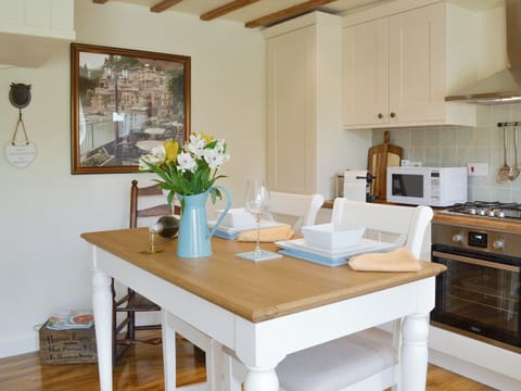 Stylish dining area with exposed wood beams throughout | West Wood Hideaway, Wrelton, near Pickering 