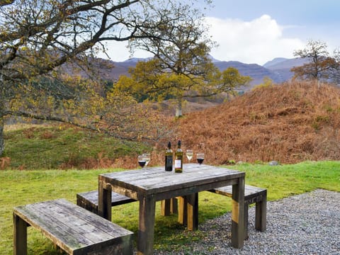 large unfenced rear garden with furniture | Coulags Croft, Coulags, Strathcarron