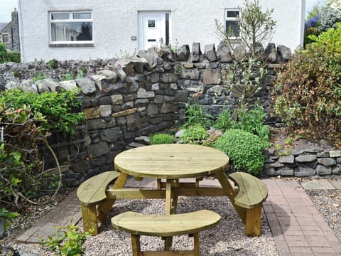 Lovely garden is full of mature shrubs | Bramble Cottage, Craster, near Alnwick