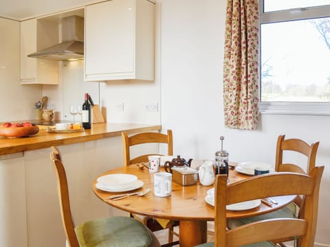 Modest dining area adjacent to the kitchen | The Coach House, Alford