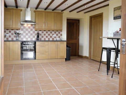 Well-equipped kitchen | Llofft Storws - Bronallt Barns, Llanynghenedl, near Holyhead