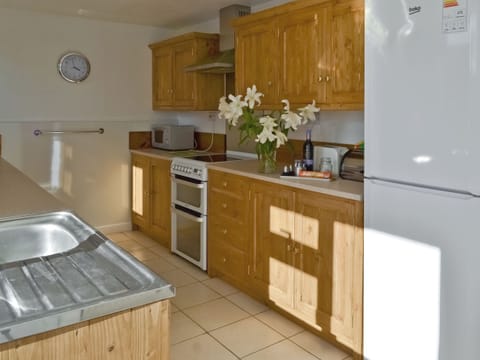 Galley style kitchen | Granny Bond’s Farmhouse - Craneham Farm, Buckland Brewer