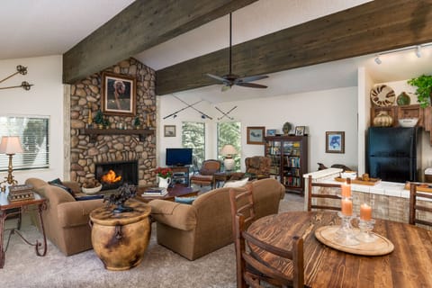 Beautiful great room with gas fireplace, living room, kitchen, dining and deck!