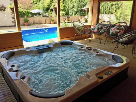 Relaxing hot tub with seating area | Linnets, Fitzhead, near Wivelscombe