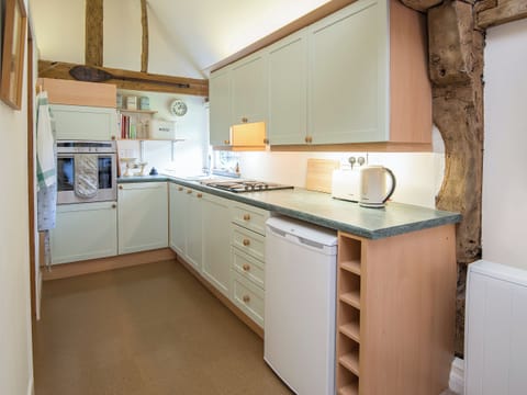 Charrming galley style kitchen | Pheasants Hill Old Byre, Hambleden, near Henley-on-Thames
