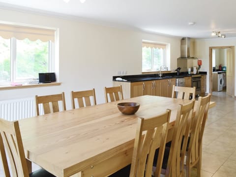 Large open plan kitchen and dining room has French windows that open out to the grounds | March Cottage, Glen Cassley, near Lairg