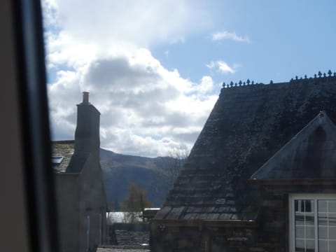 Glimpse of derwent water from the bedroom | 1 Tower Cottage, Portinscale, near Keswick