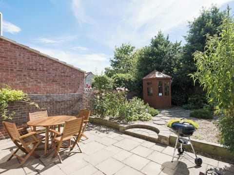 Peaceful, enclosed courtyard garden with patio | Camelot, Weybourne, near Holt