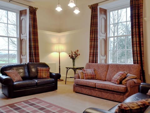 Characterful living room with high ceiling and large windows | The Factor&rsquo;s House, Kilmartin Glen, near Lochgilphead