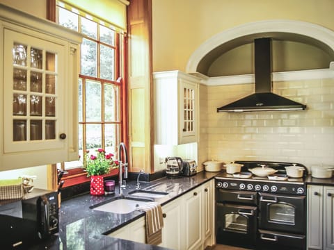 Modern farmhouse kitchen with wood burning stove and range cooker | The Farmhouse at Gradbach, Gradbach near Buxton