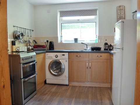 Immaculately presented kitchen with breakfast area | Didfa, Llangoed, near Beaumaris