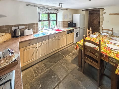 Stylish dining area within well-equipped kitchen | Cider Cottage - Higher Checkridge Farm, Hawkchurch, near Lyme Regis