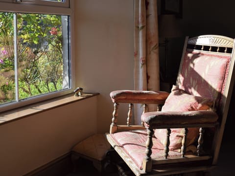 Seat in living room overlooking garden | Harriet&rsquo;s Cottage, Muker near Reeth