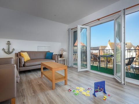 Spacious living area with French doors to balcony | Grebe - Daisy Broad Lodges, Wroxham