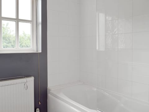 Family bathroom with shower over bath | Dormers, Leiston
