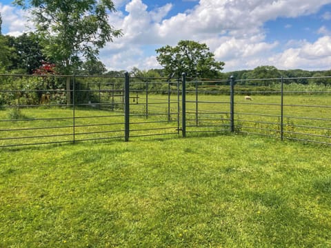 Lawned garden and far-reaching view across the open countryside | Barleycorn, Holnest, near Sherborne