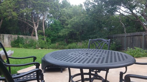Patio Features Seating for Six, Fire Pit, Charcoal Grill In Private Setting