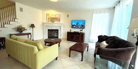 Family Room Features 55Inch LEDTV, Roku for Streaming, Fireplace, Greenbelt View