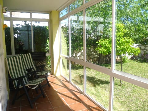 Inside Conservatory looking out to Private Garden
