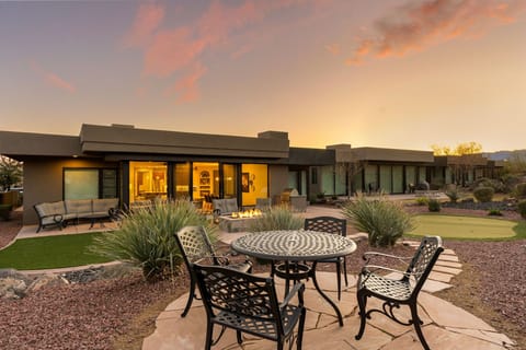 Backyard with Putting Green, Dining Tables, Grill, & Firepit