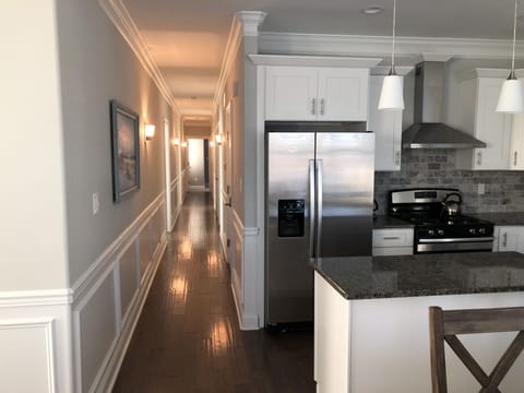 Hallway to all bedrooms/baths and door to ground floor recreation room
