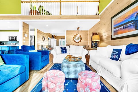 Great room sitting area. Blue chairs swivel to watch the game!