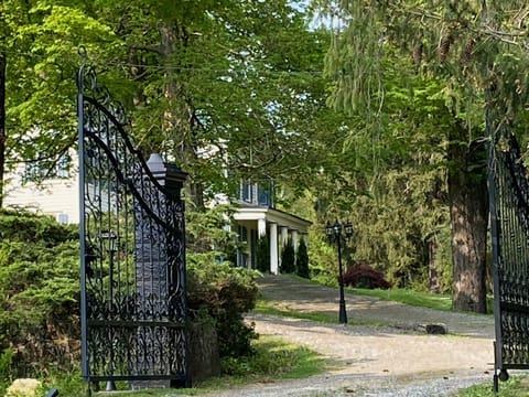 Driveway toward the house through iron gates