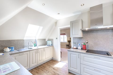 Kitchen adjoining lounge/dining area.