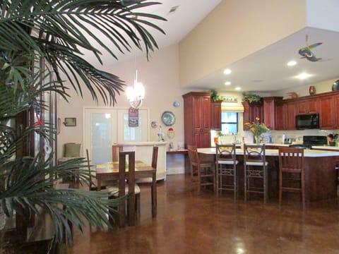 Look at view of large Kitchen area from Dining area.