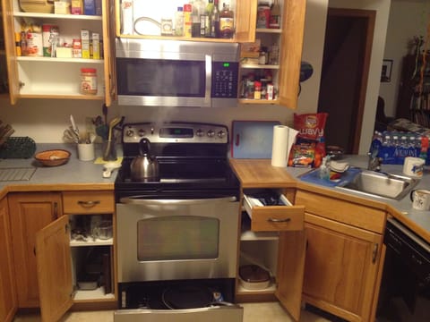 glass top stove, dishwasher, cookie sheets, baking dishes, utensils, spices.