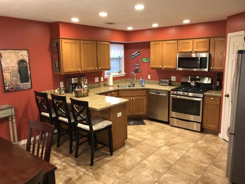 kit w/ lots of seating, coffee maker, blender, all the dishes & cooking needs