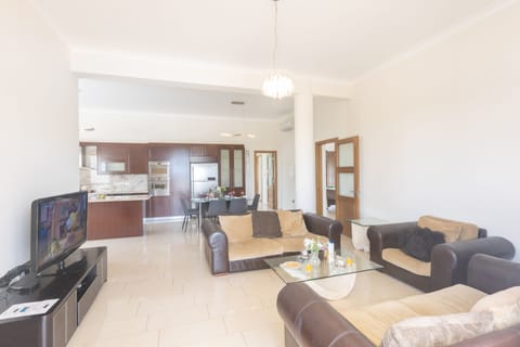 Living room wtih comfortable seating and widescreen, Satellite TV