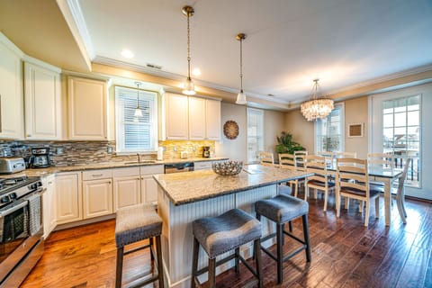 Gleaming chef’s kitchen with island seating