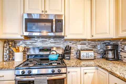 Fully-equipped kitchen with stainless steel appliances