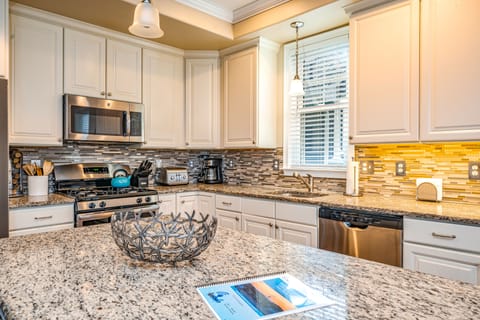 Bright and spacious kitchen with granite countertops