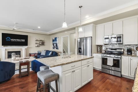 Gleaming chef’s kitchen with island seating
