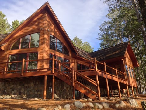 Back of home with access to the deck and 3 season room for relaxing & grilling