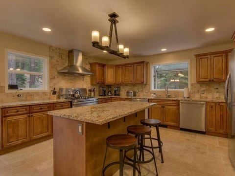 Spacious kitchen with granite island and cozy seating area