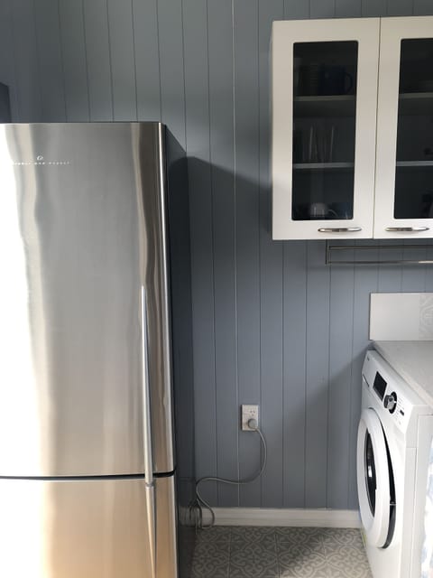 2 fridge/freezers, 1 for drinks plus front loader washing machine are available.