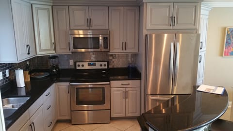 Remodelled Kitchen with all stainless steel appliances and granite.