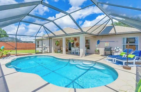 Charcoal grill, Lounge chairs, pool toys, inflatables, spacious seating area!