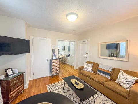 Living Room: TV Mounted to the wall on adjustable mount making it easy to see TV from all Angles 