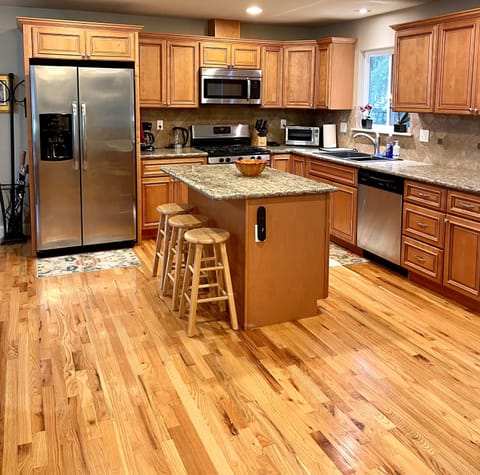 "Grand Room" kitchen. 50% of main floor is kitchen + front room for gathering.
