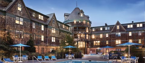 Sit around the adult "quiet pool" with indoor/outdoor kids pool in the distance.