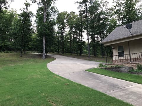 Concrete drive to Charlie Stover Road.