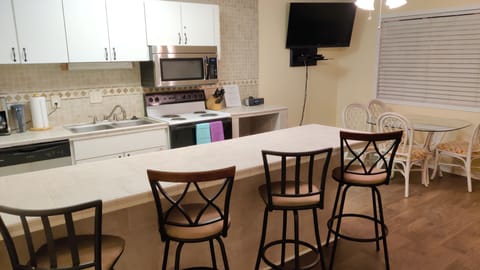 Kitchen /living area with 50" TV.