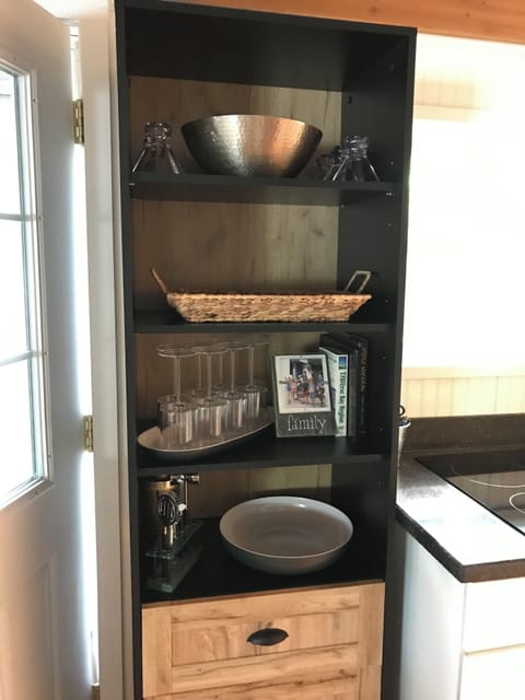 Added this cabinet for extra glasses and trays/bowls for entertaining.