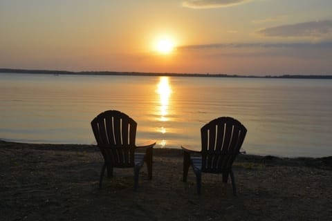 Level sandy beach with Sunsets